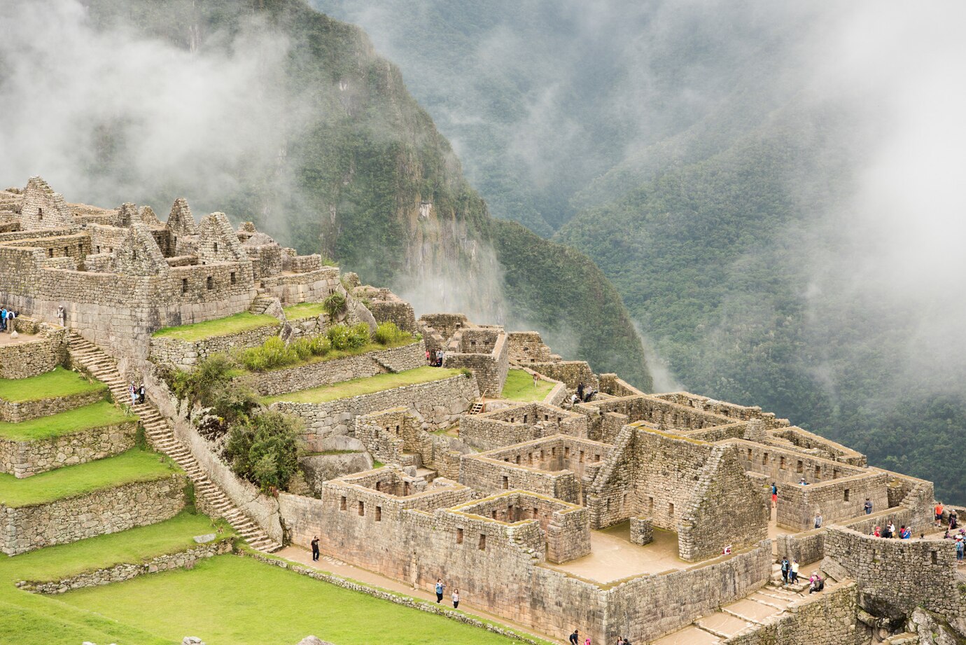 City in Choquequirao with stone ruins and greenery enveloped in mist