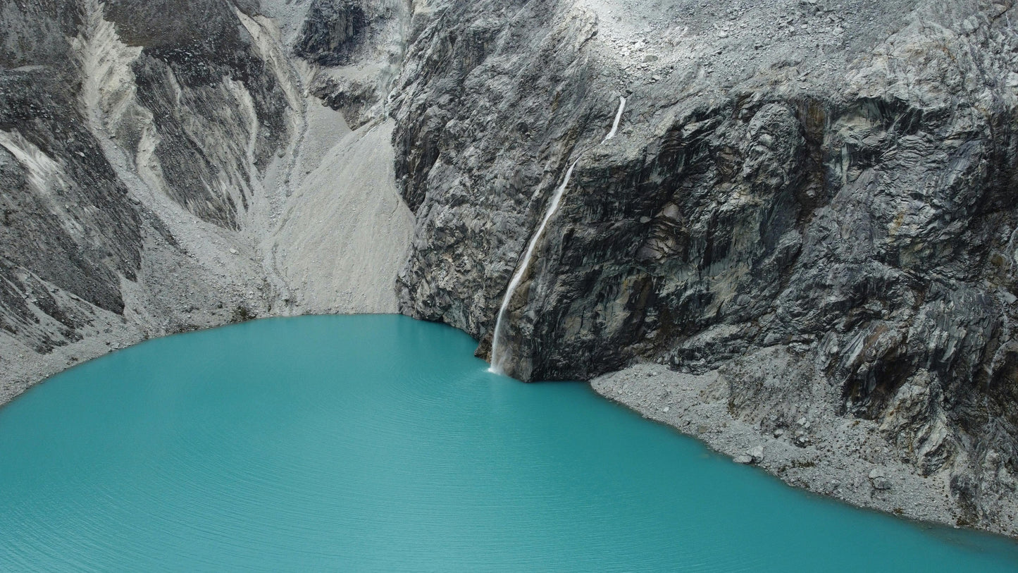 Turquoise lake surrounded by rocky mountains