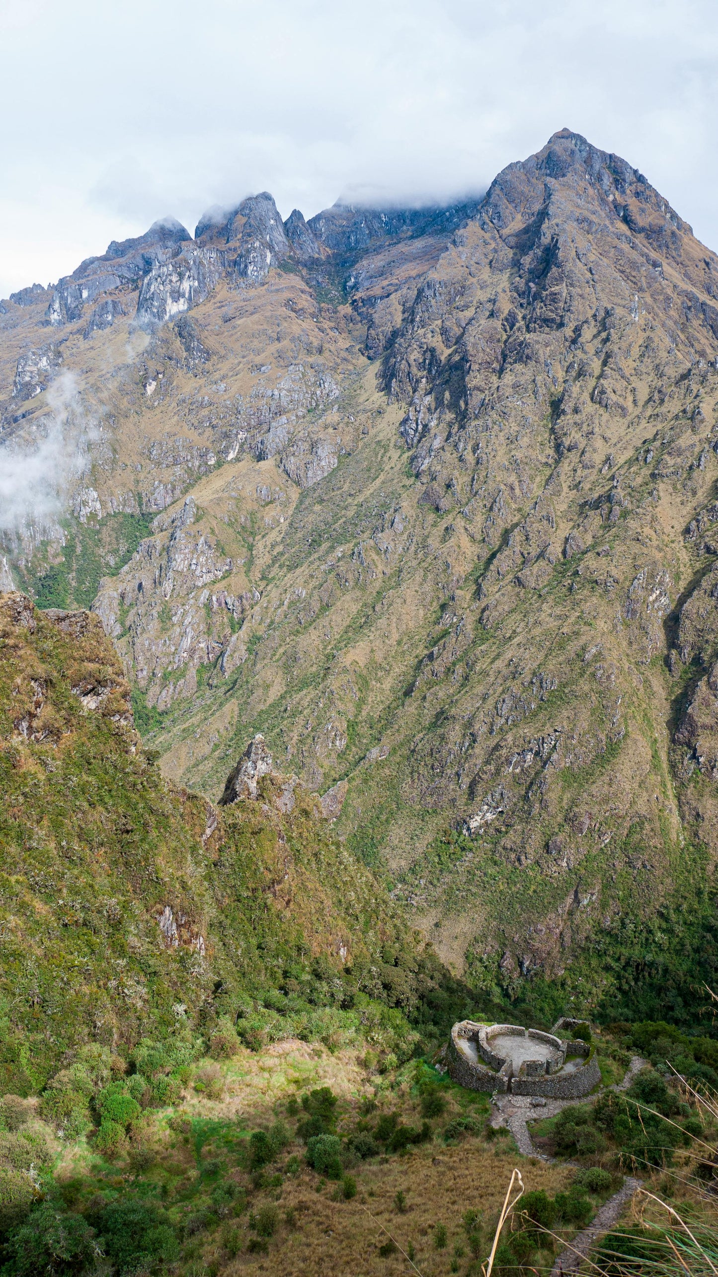 Mountainous landscape with a path winding through the valley