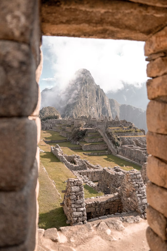 Stone ruins of Machu Picchu with a mountain in the background