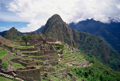 Machu Picchu with terraced buildings and mountainous landscape