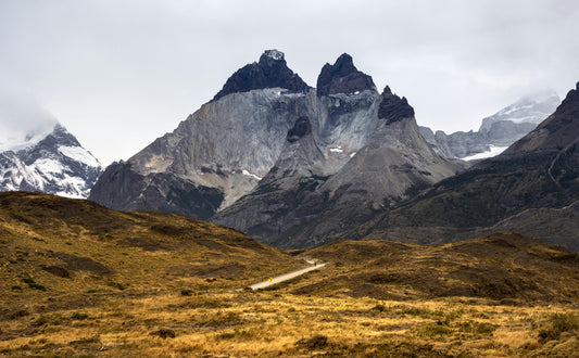 Scenic view of mountains with a path in the foreground