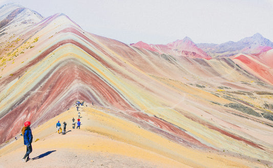 Colorful mountain landscape with people at Rainbow Mountain, Peru